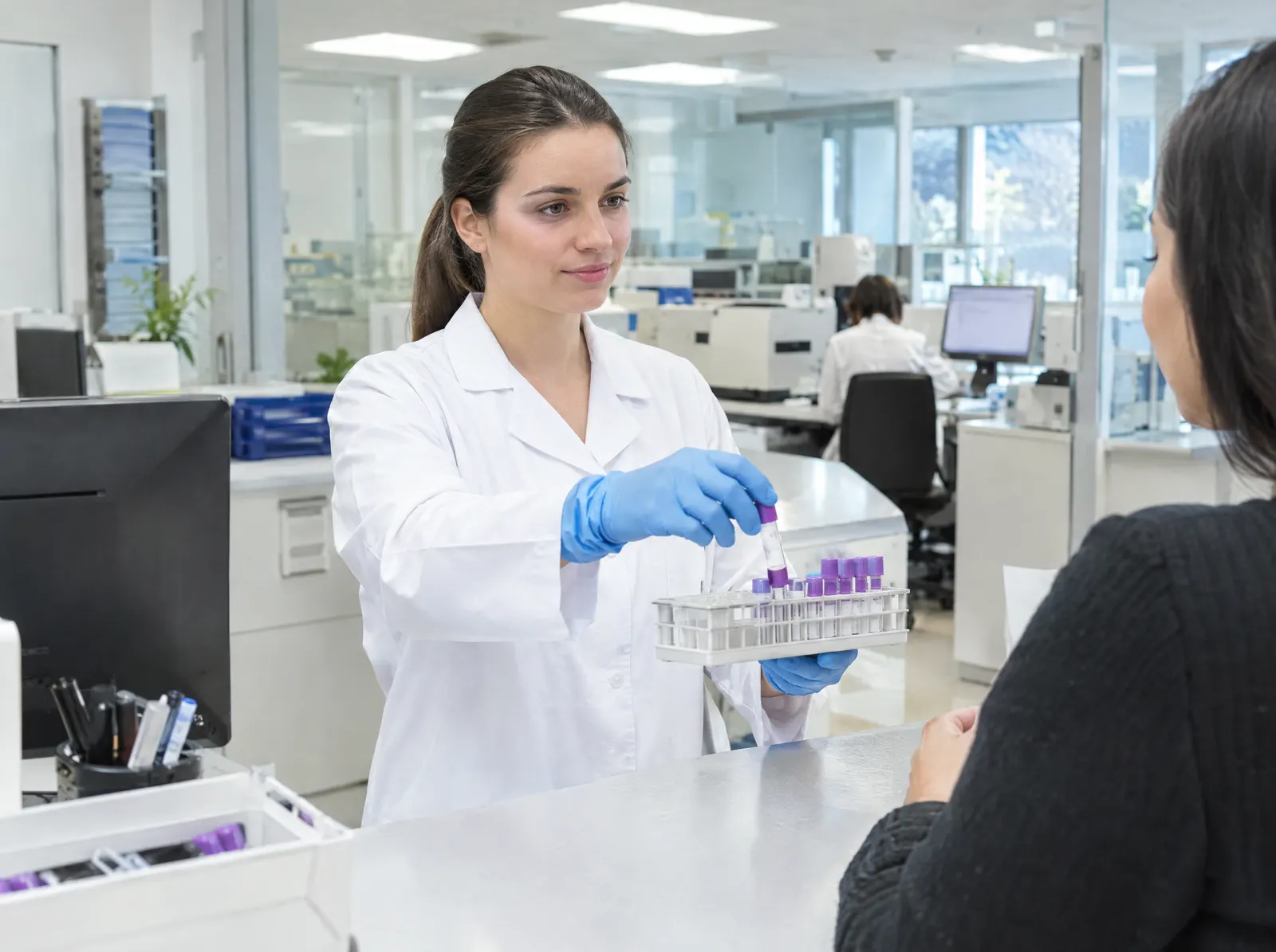 Scientists working with test tubes in a laboratory