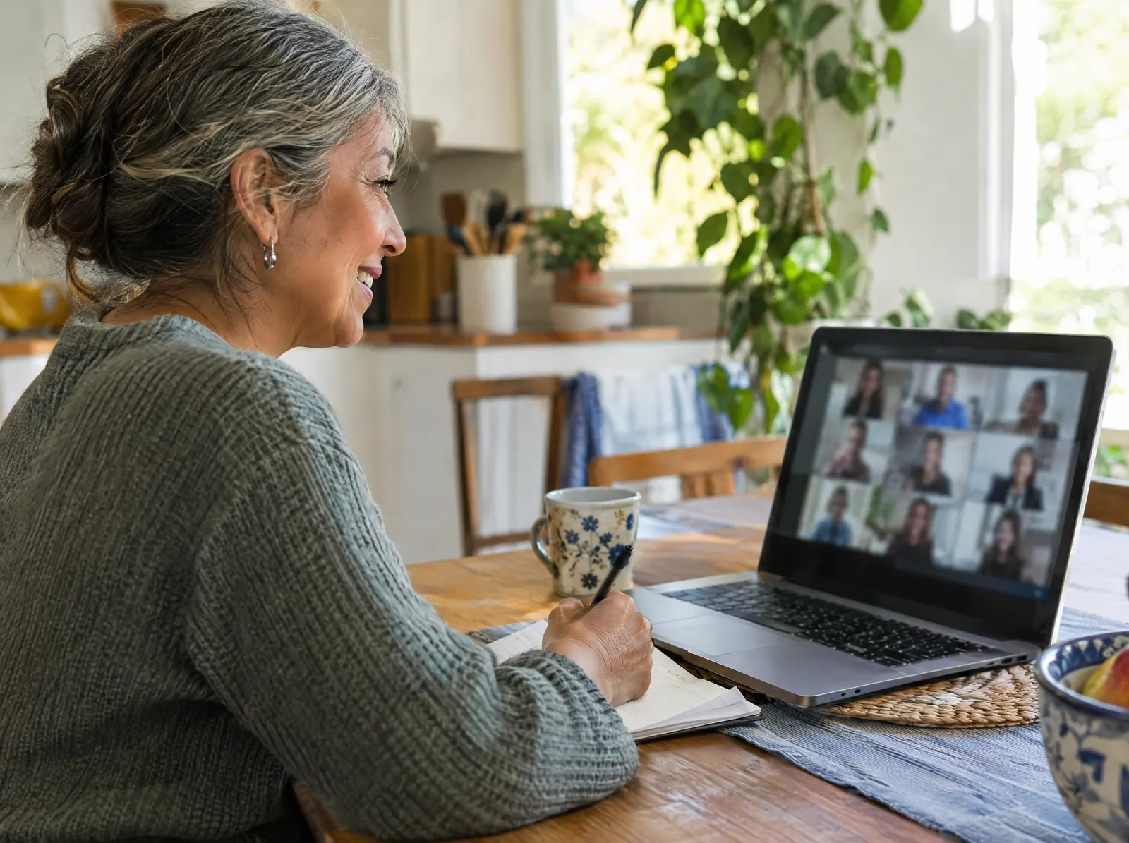 Student watching an online class on a laptop